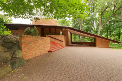 Wright invented the carport. On this FLW house, it's carport-as-sculpture. (Photo James Michael Kruger)
